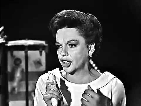 A woman is singing into a microphone