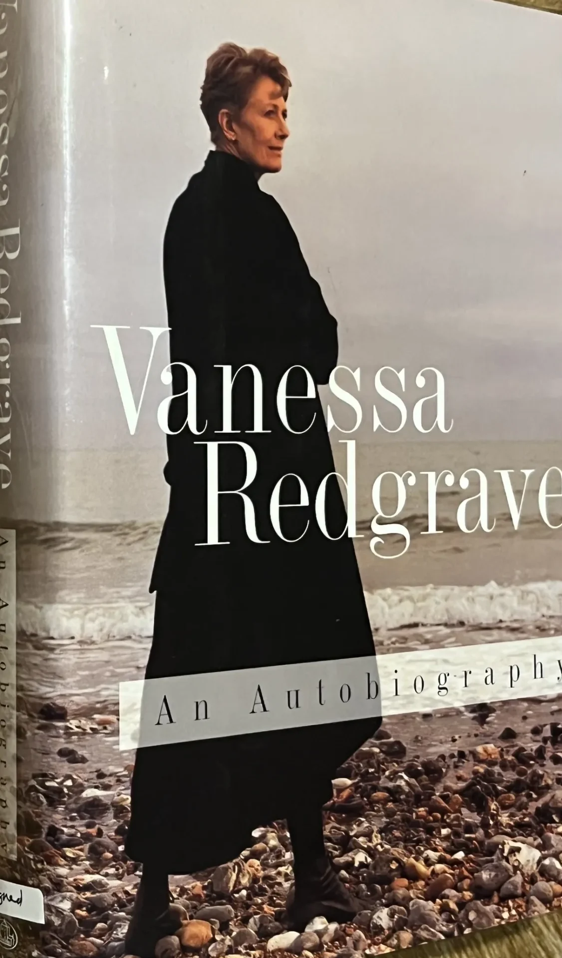 Book cover showing person by the sea