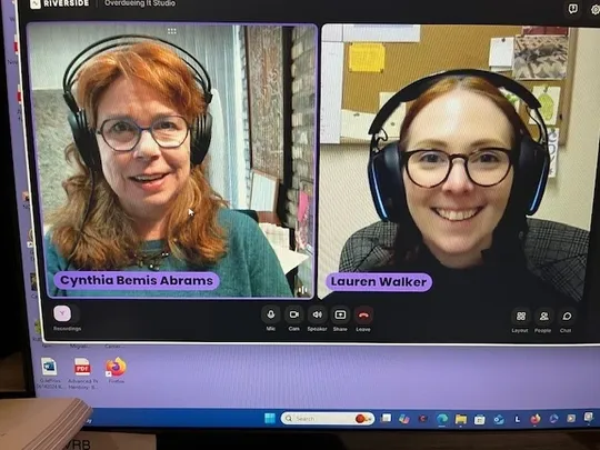Two women in a video call on laptop screens